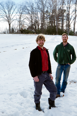 Two men standing in a snowy field