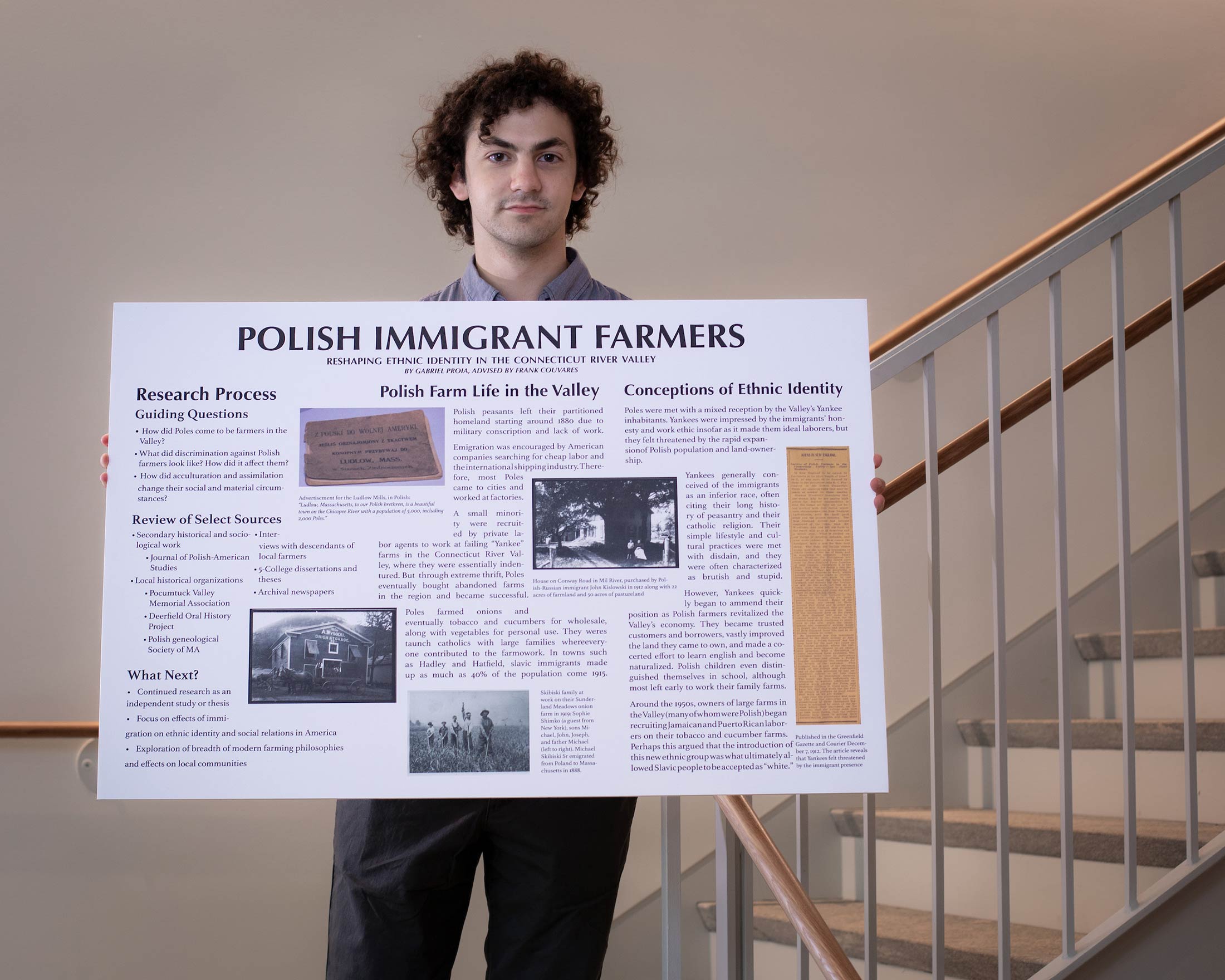 Gabriel Proia holds his research poster titled Polish Immigrant Farmers, Reshaping Ethnic Identity in the Connecticut River Valley.