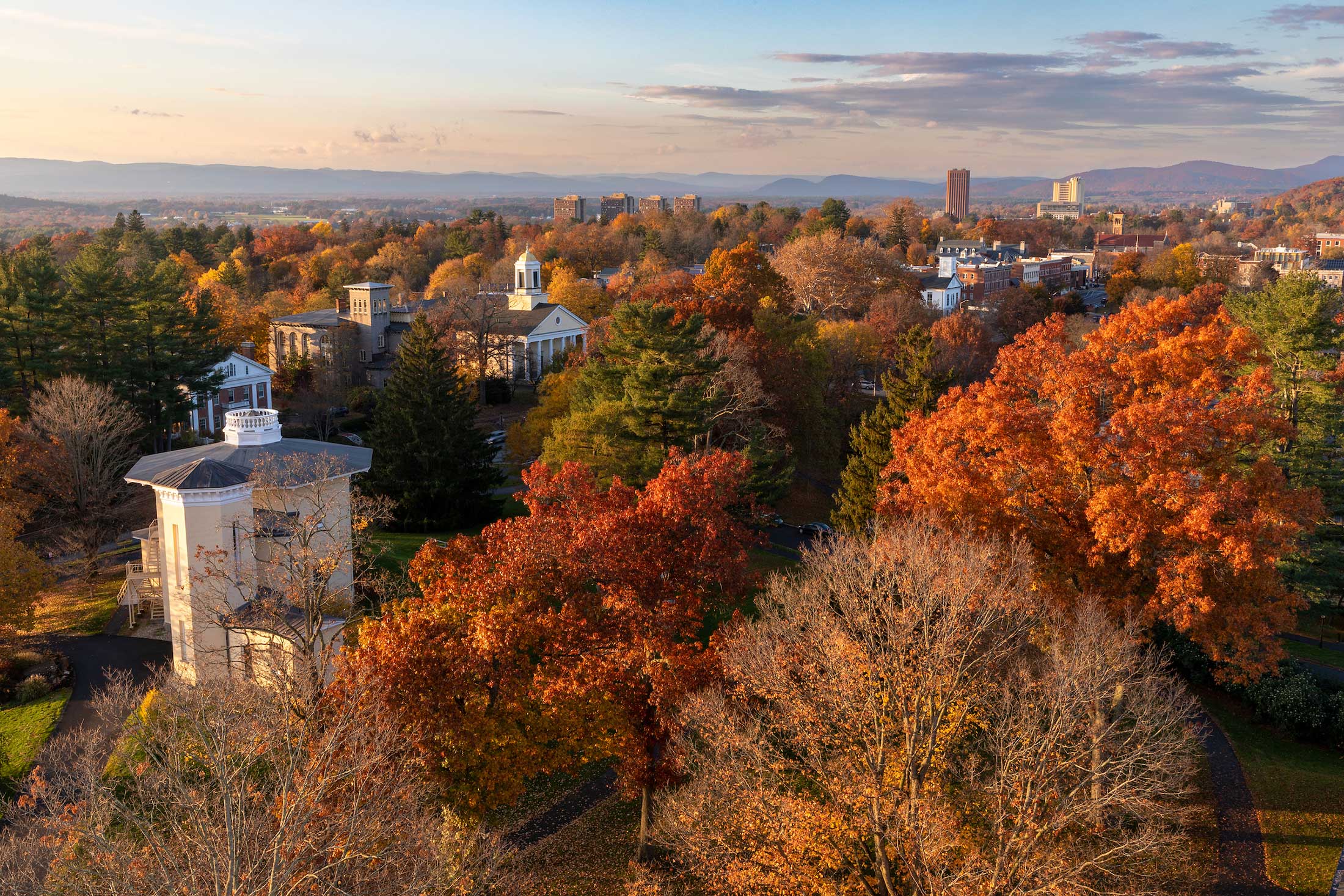 An aerial view from the Amherst College campus with the town of Amherst seen in the distance.