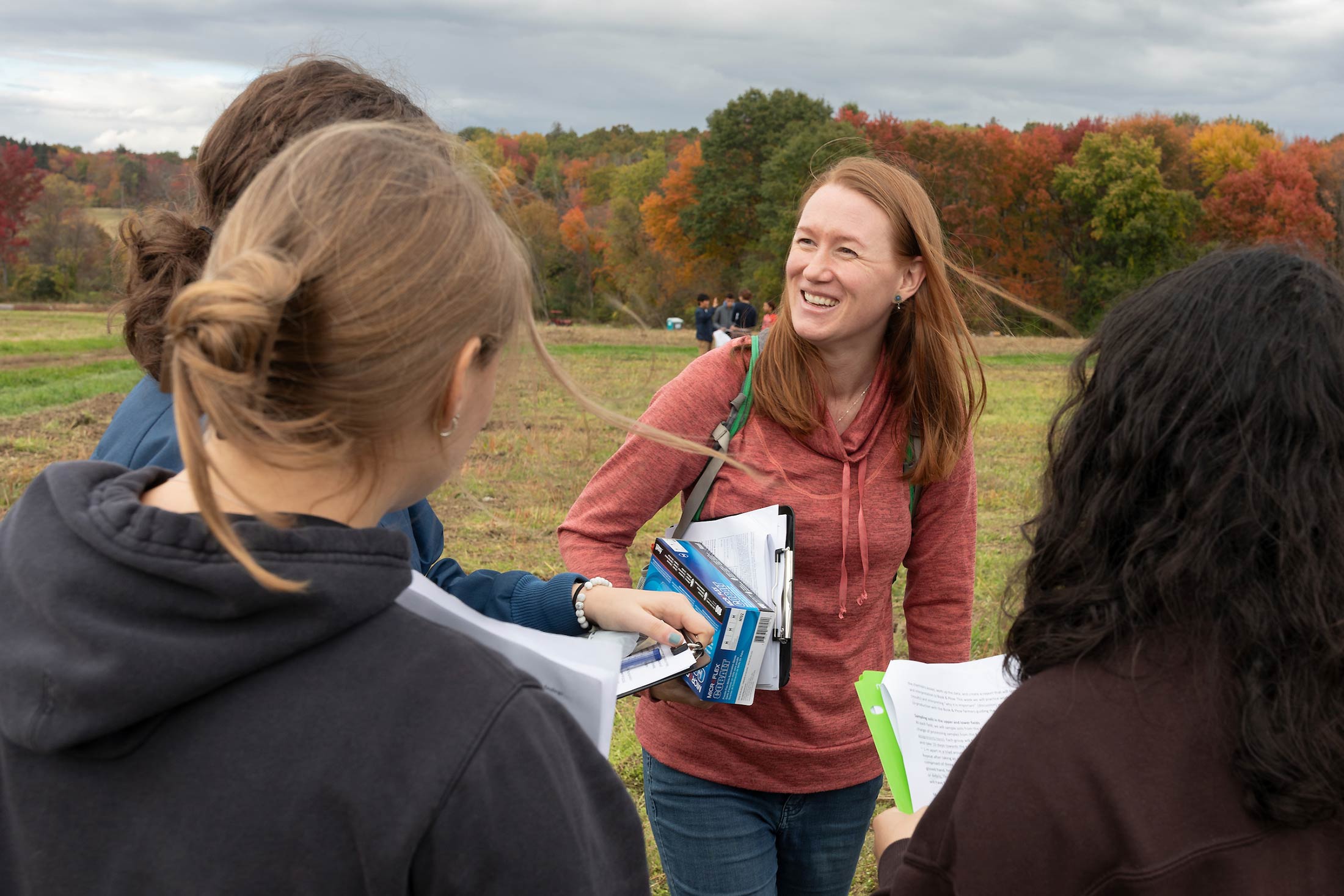 Professor Rebecca Hewitt with students at Book & Plow Farm.