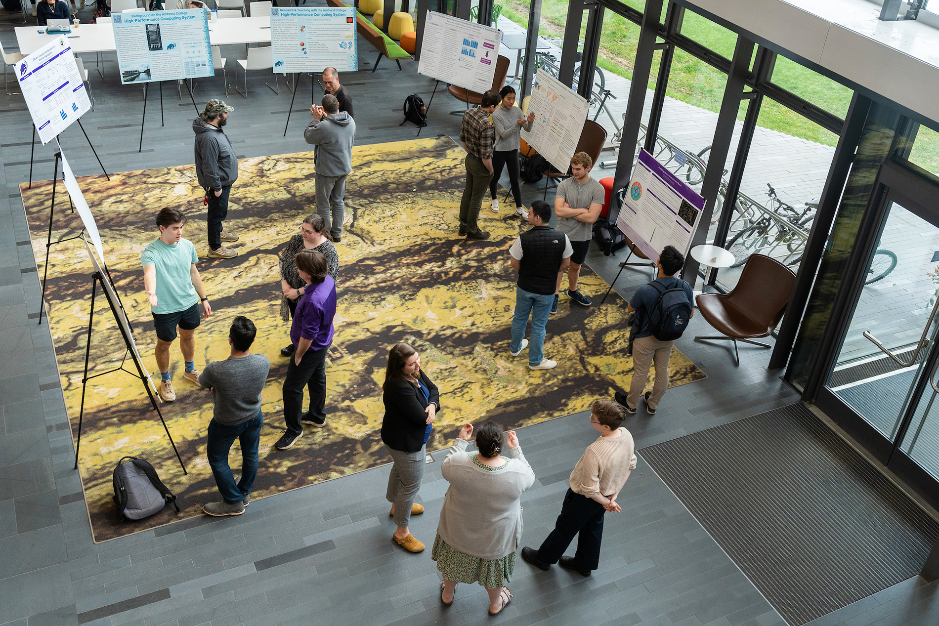 Students, faculty and staff gather in the science center at Amherst College.