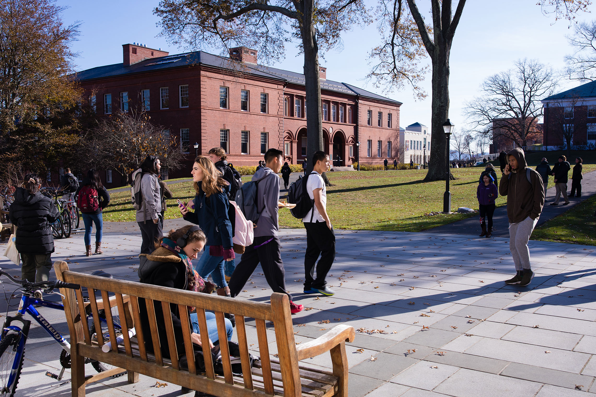 Students walking to classes on a sunny day in early fall at Amherst College.