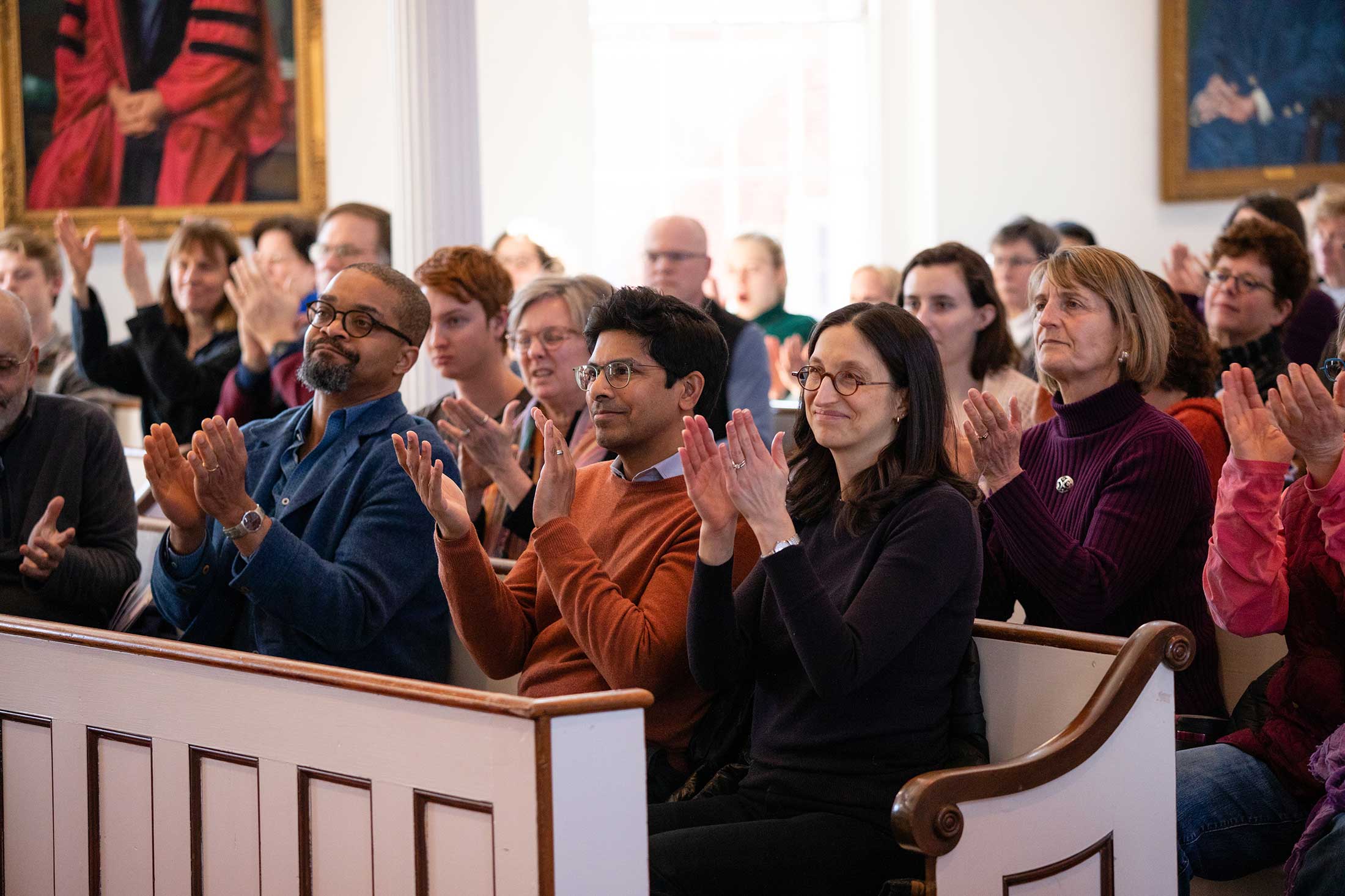LitFest audience members in Johnson Chapel applauding