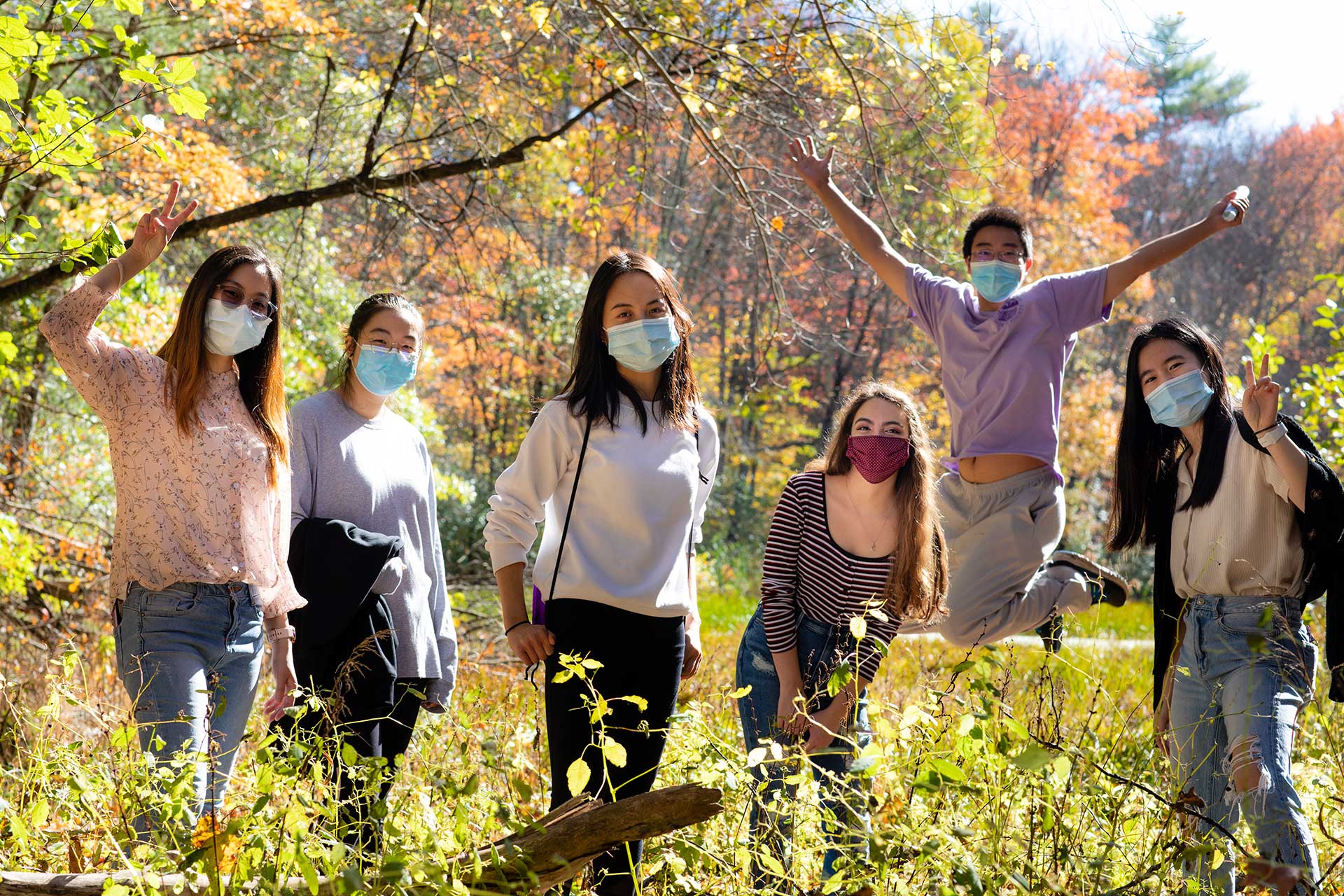 Six students pose for a photo on the sanctuary land