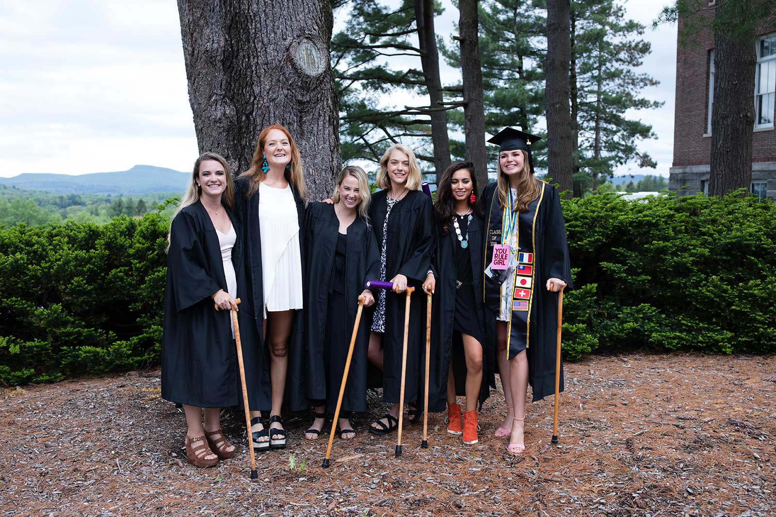 Graduates posing with their Conway Canes after the ceremony