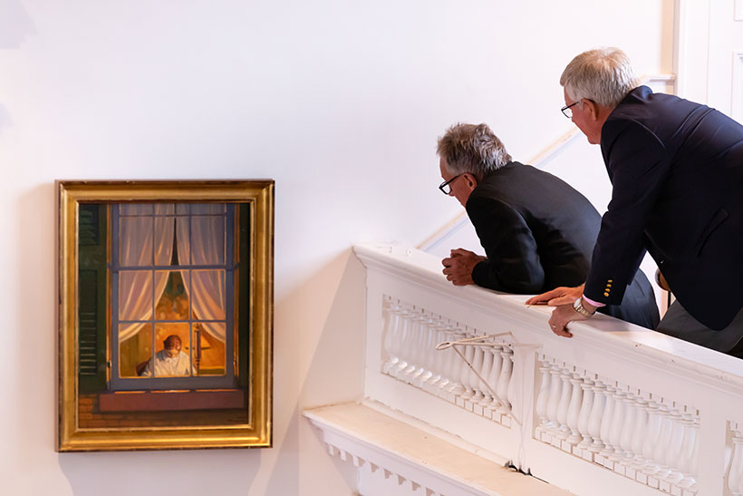 People examining one of the Emily Dickinson paintings