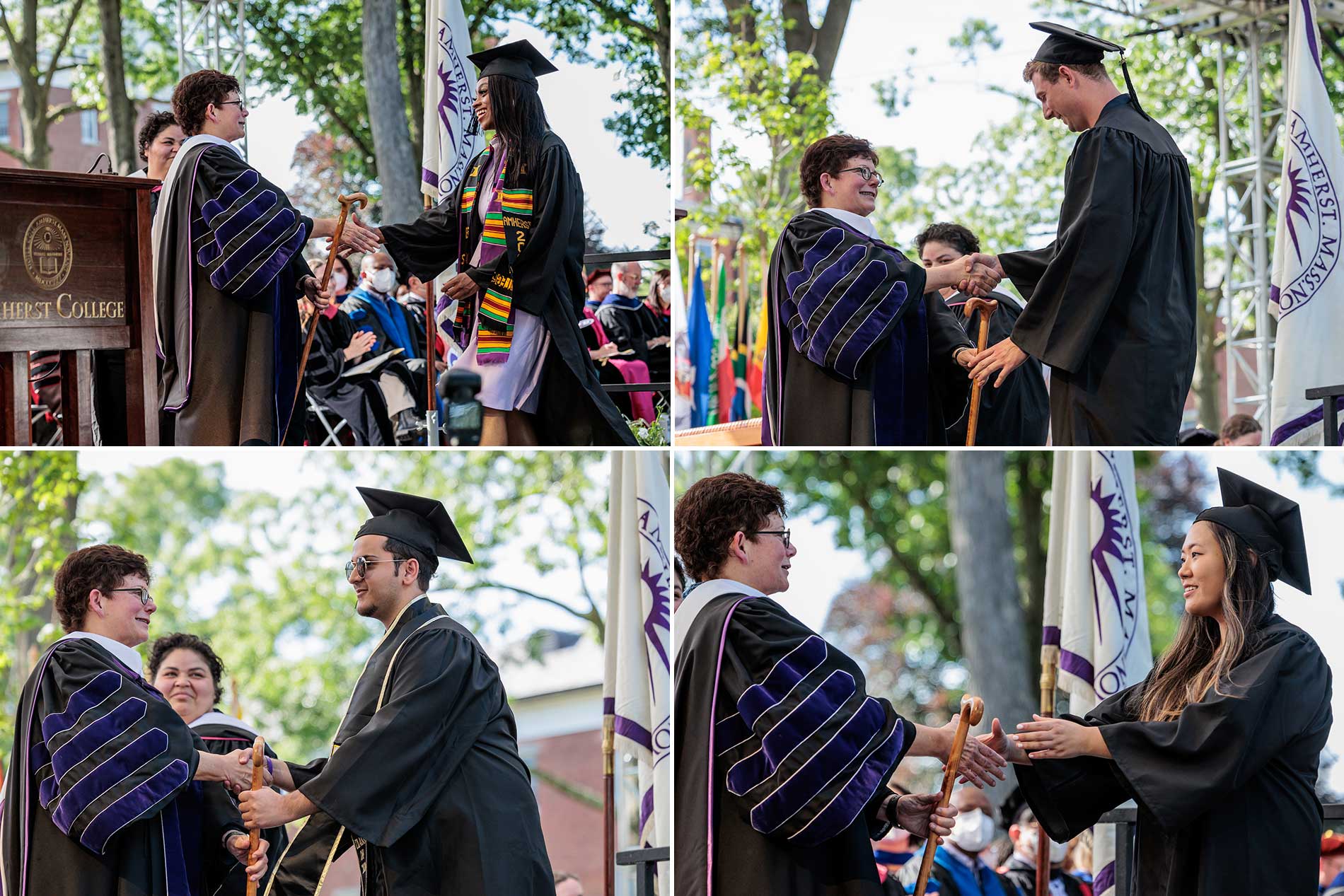 Four graduates shake hands with President Martin after receiving their diplomas.