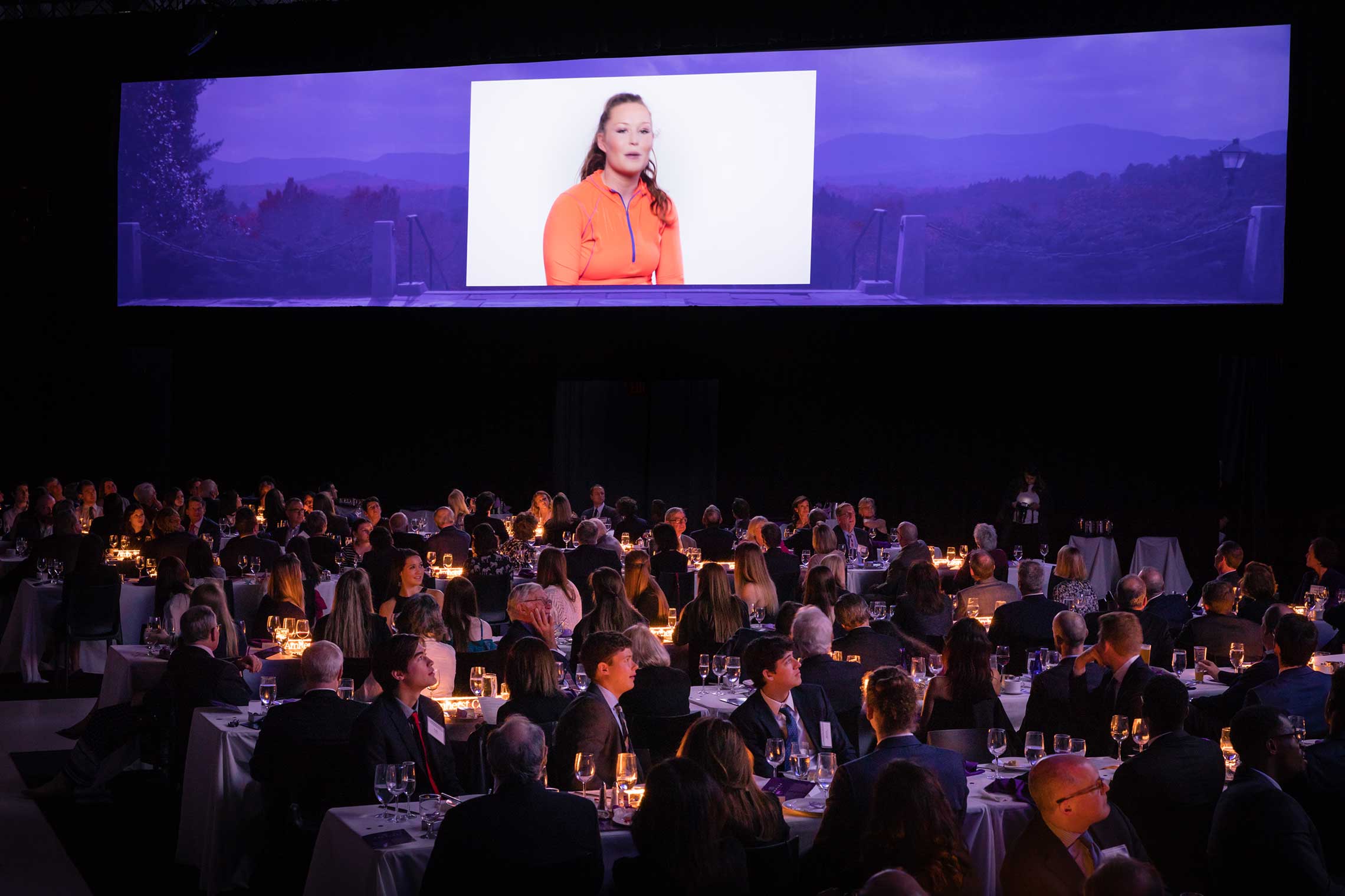 A video plays during the campaign launch dinner
