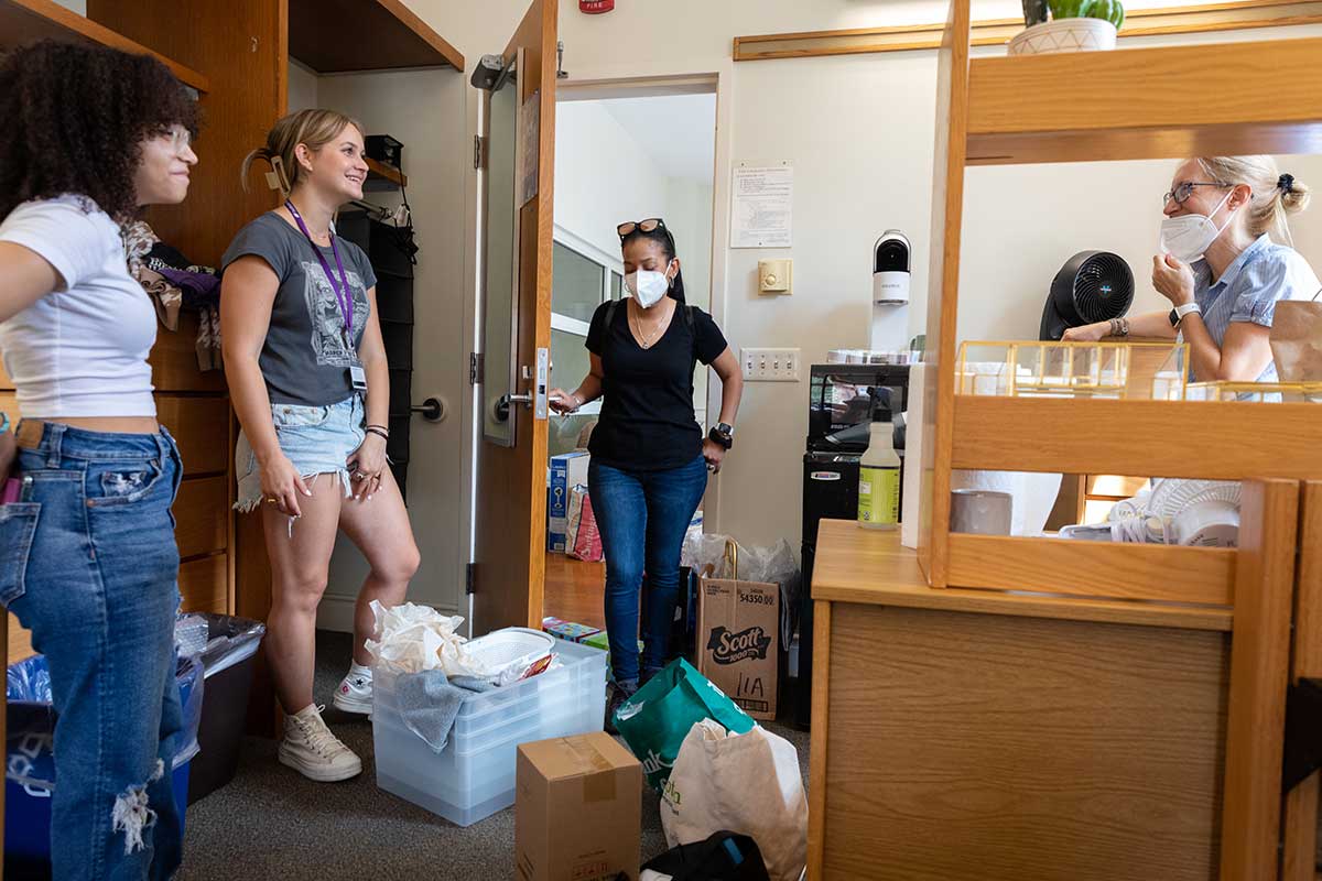 Two new students moving into their dorm room at Amherst College.