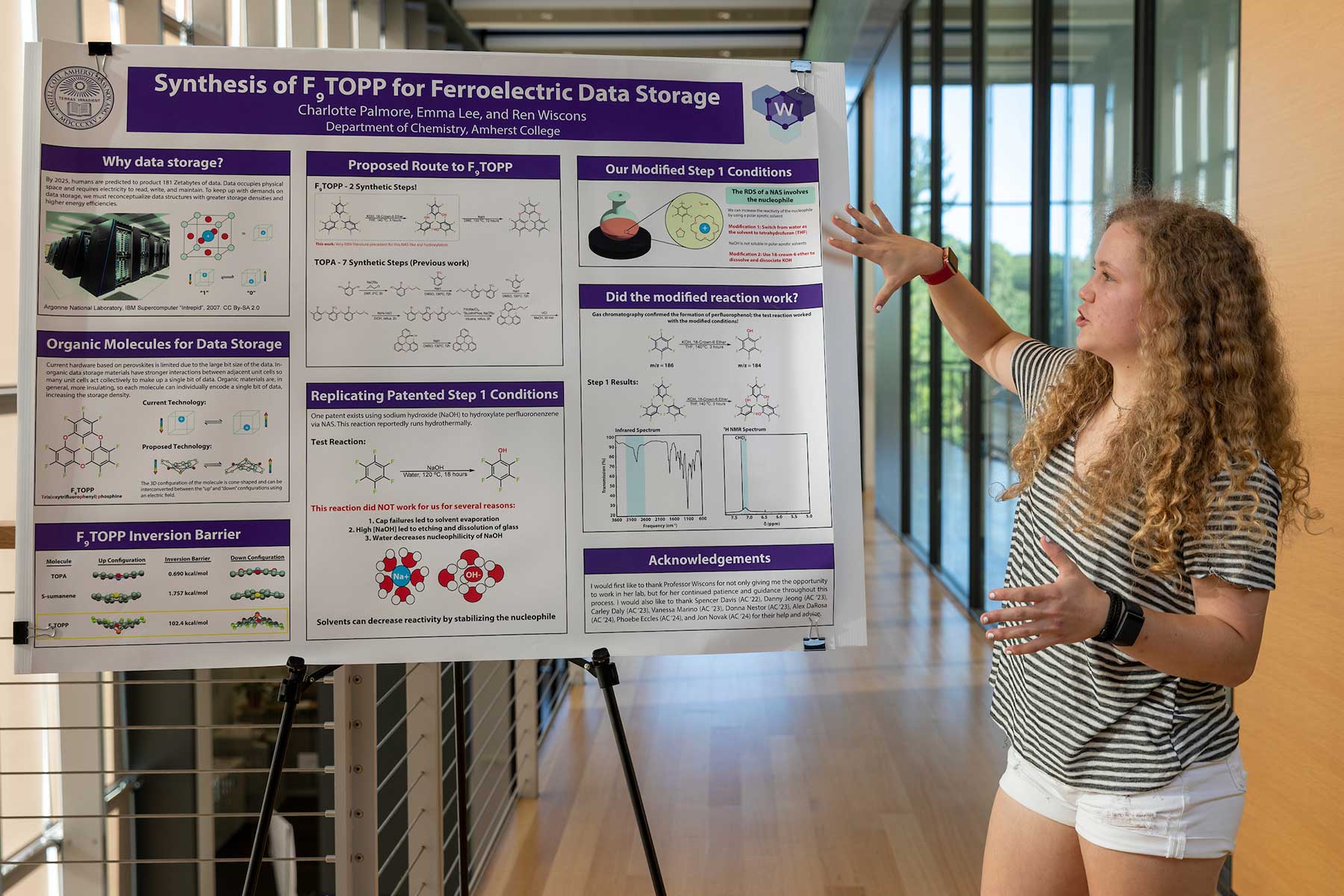 Charlotte Palmore '24 points to a poster on her summer research on Synthesis of F9TOPP for Ferroelectric Data Storage.