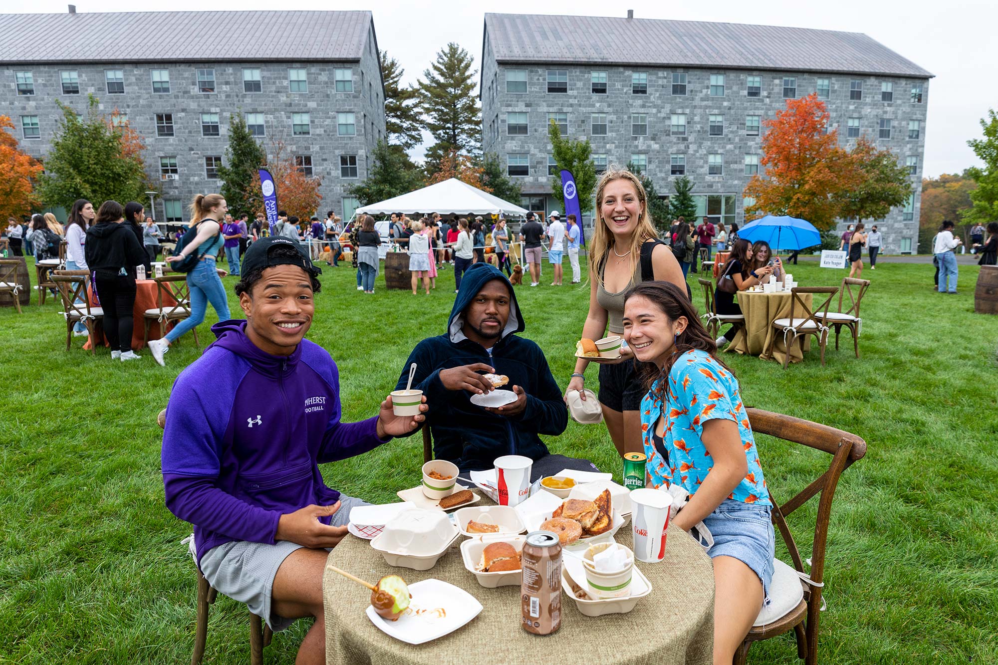 Students sample a variety of food options at the bicentennial party