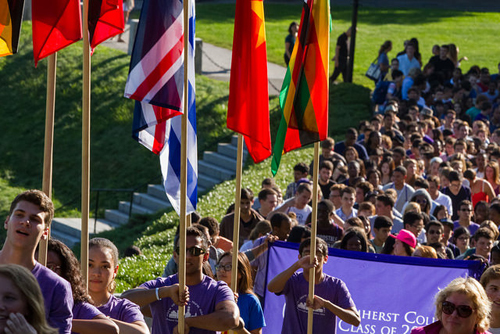 students carrying flags at Orientation