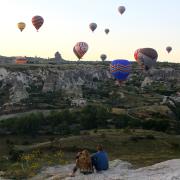 Hot air balloons over a canyon
