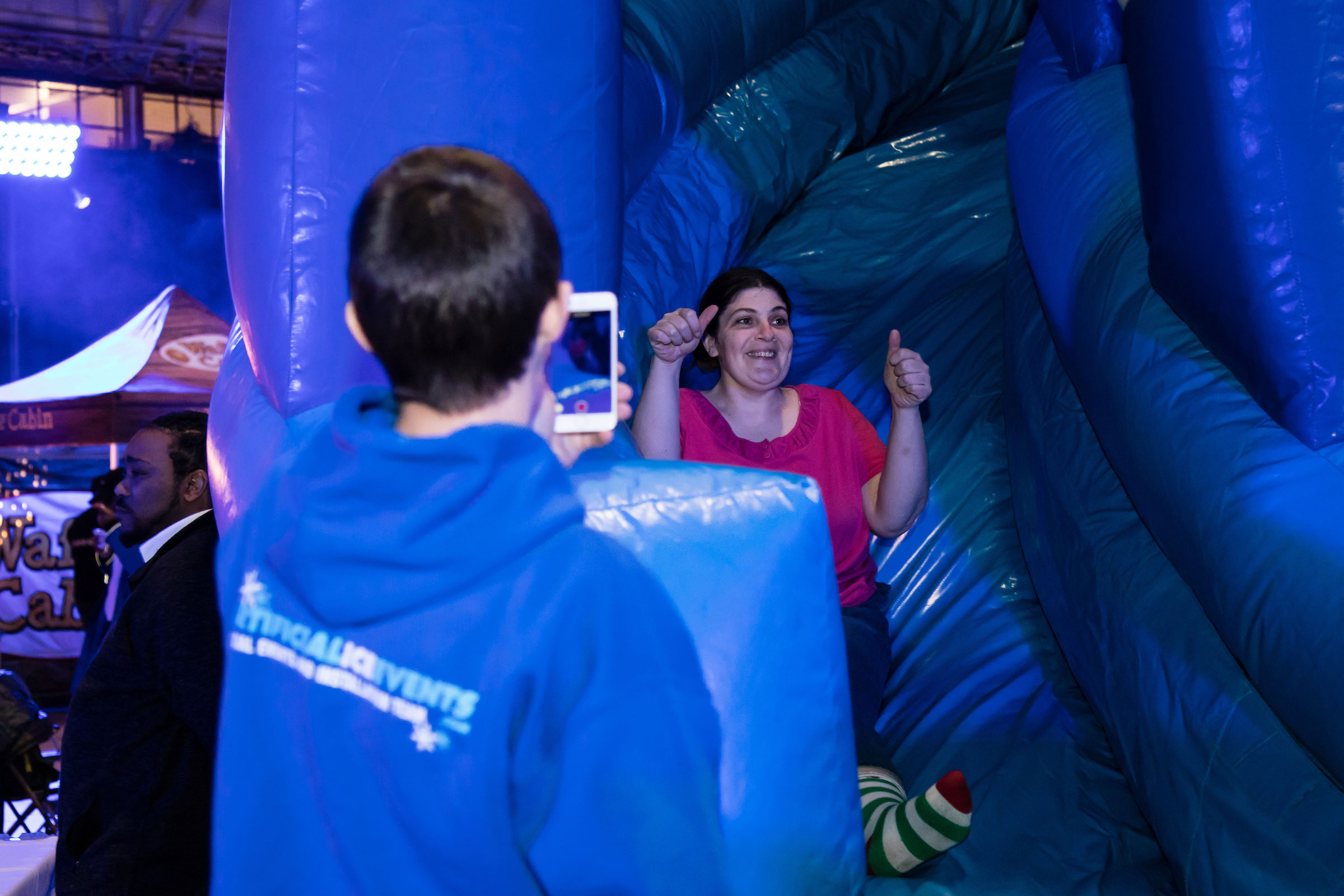 A woman rides the inflatable slide