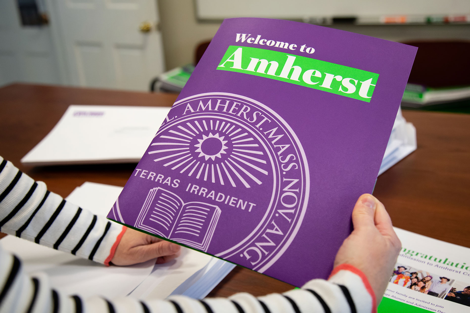 A closeup of packet that admitted students receive from Amherst College.