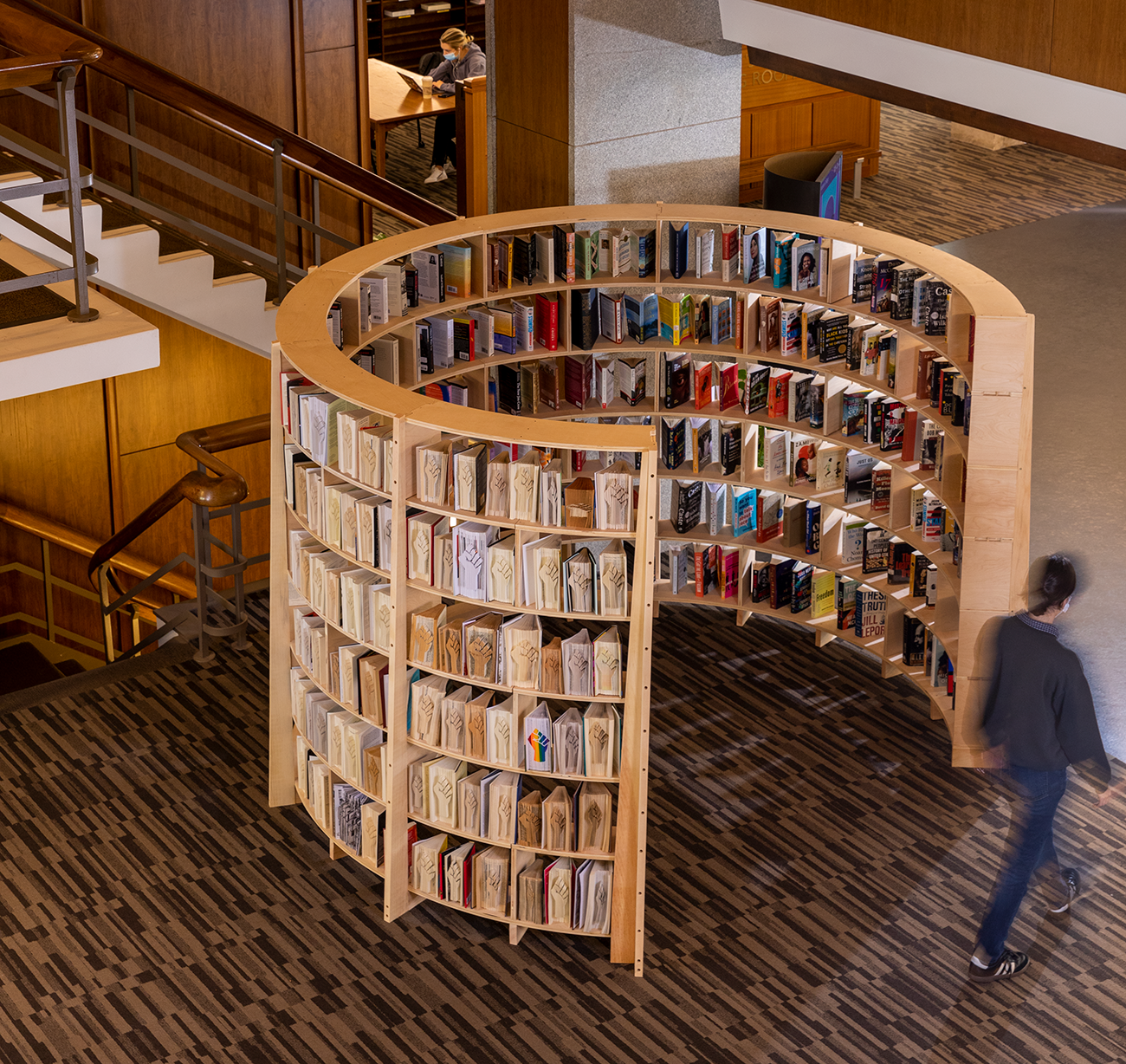 A circular bookcase filled with books in the Frost library