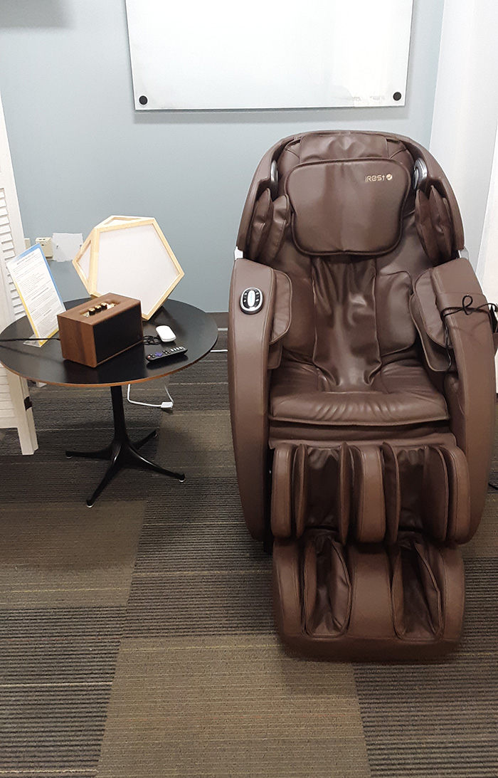 A massage chair next to a table