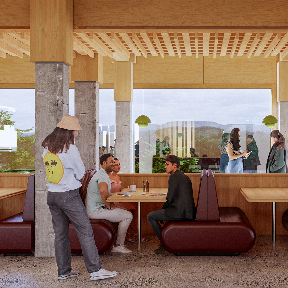 Students eating in a modern dining area with a view towards mountains out a large window in the background