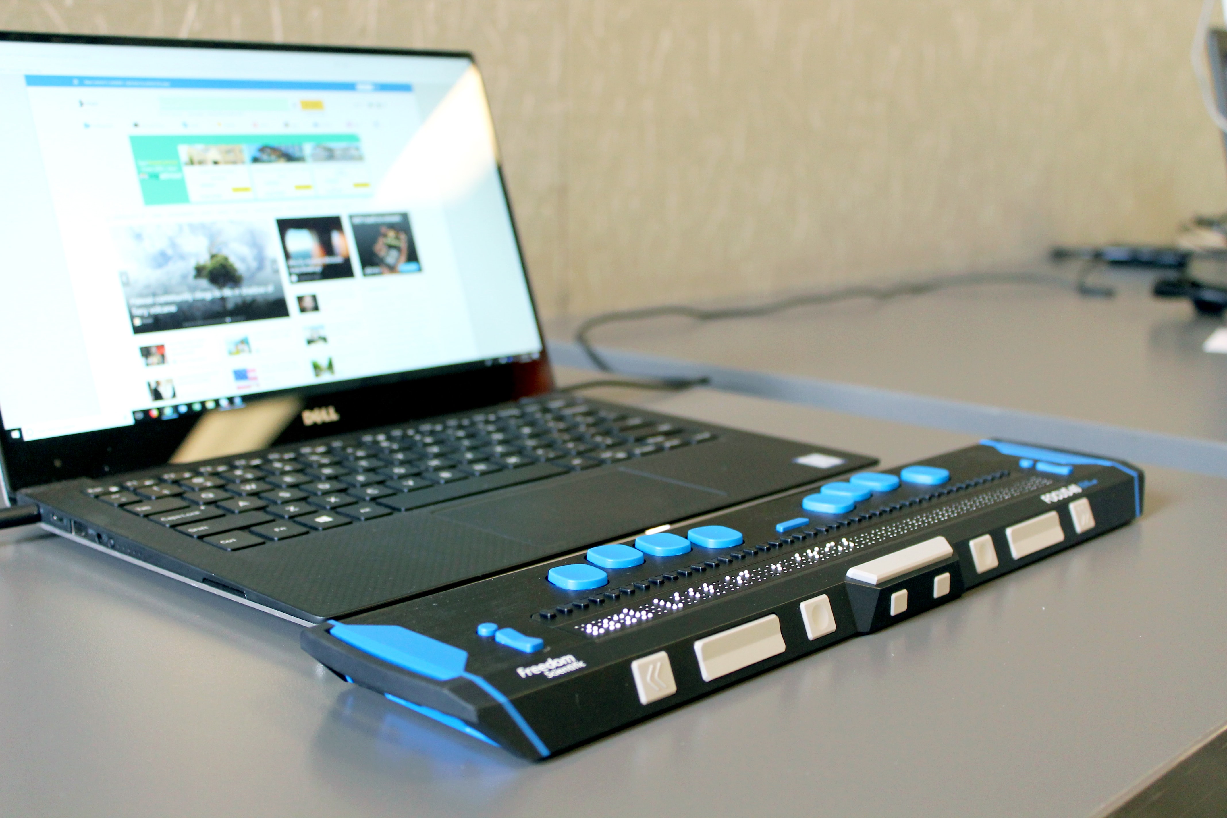 a Braille device attached to a laptop