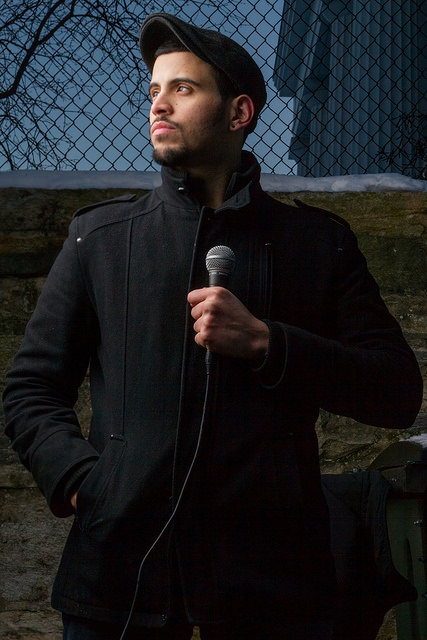 Saul Grullon holding a microphone