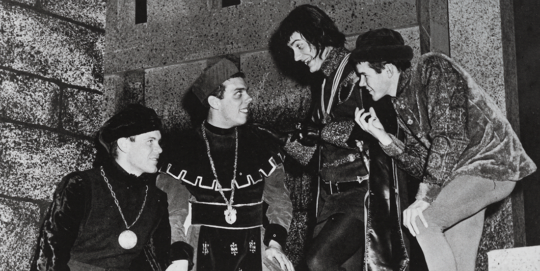 A black and white photo of four actors in Shakepeaeran dress