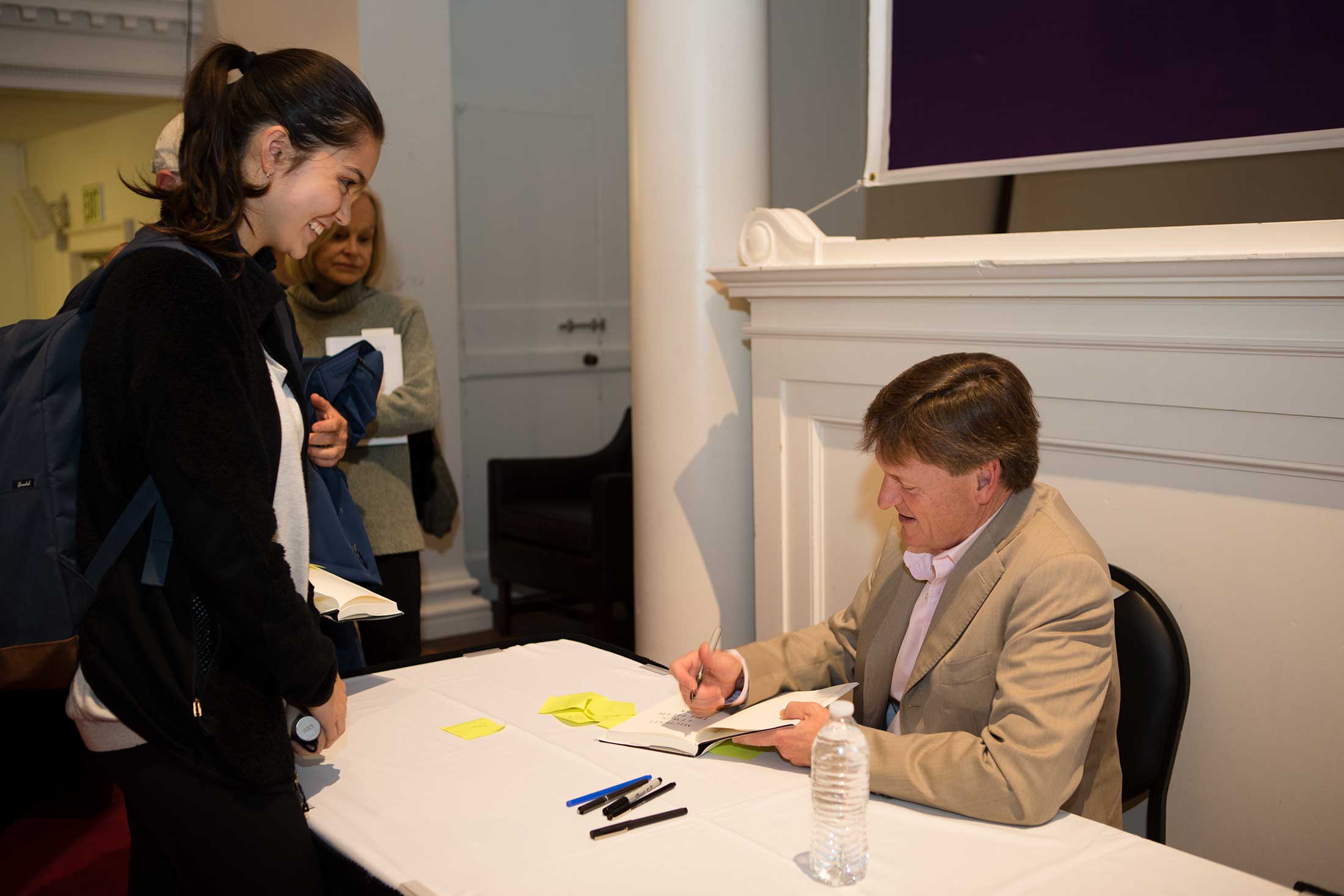 An Amherst student speking with Michael Lewis at his book signing.