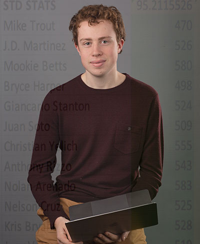 Alexander Schwartz holding a laptop computer