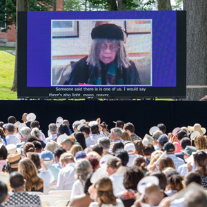 Sonia Sanchez speaks remotely on a display screen at Commencement