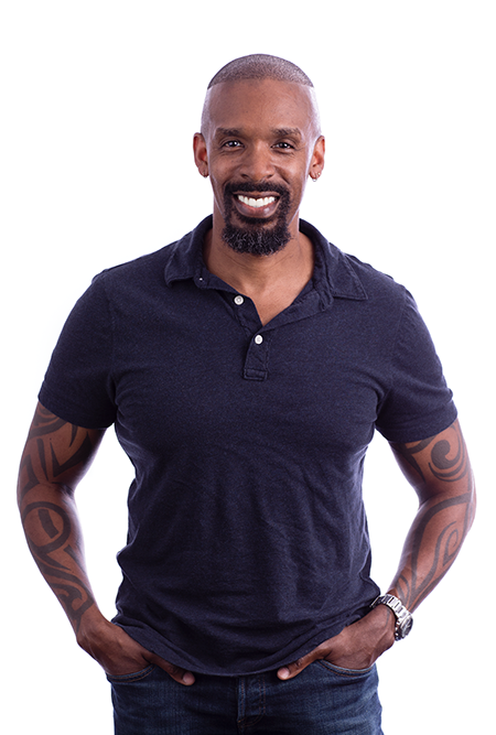 A Black man in a short-sleeved shirt smiling