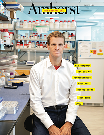 Cover of magazine showing a man in a white shirt sitting in a medical laboratory.