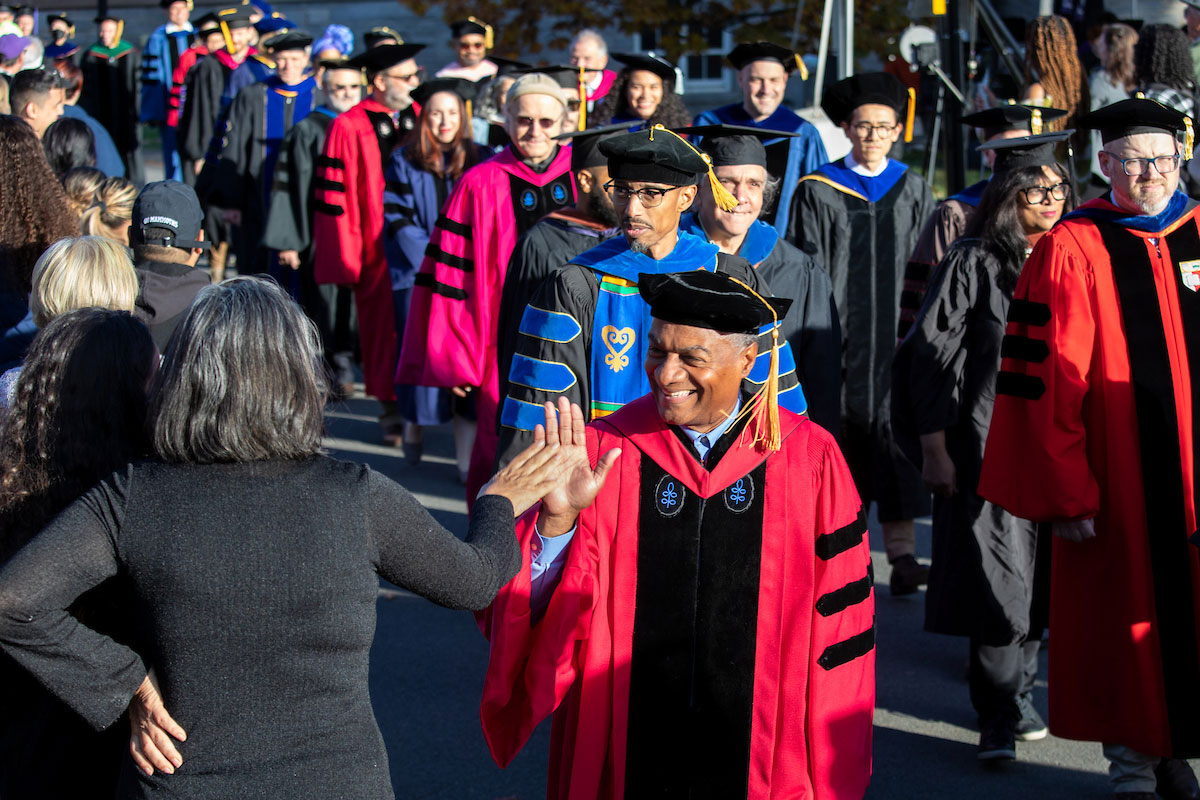 A procession of faculty in academic regalia.