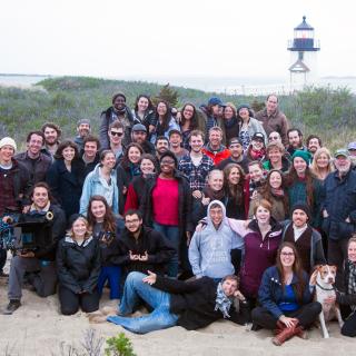 Crew photo of mostly students on their last day of filming the film, Peter and John, on a beach.