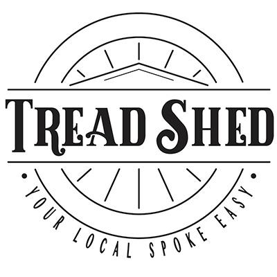 A round logo with the words Tread Shed in the center