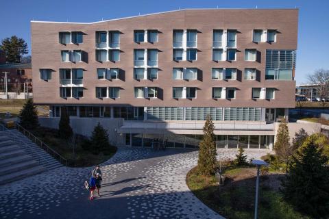 Outside view of Greenway Dorm A being renamed as Ford Hall