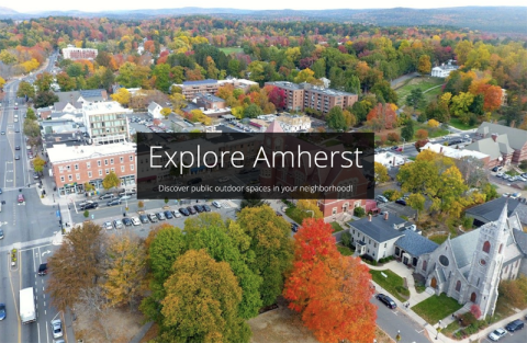 Aerial view of the town of Amherst with the title Explore Amherst, Discover public outdoor spaces in your neighborhood