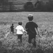 Children running through a field