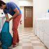 A young man doing laundry